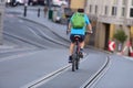 Cyclists from behind between tram tracks in Gmunden, Austria